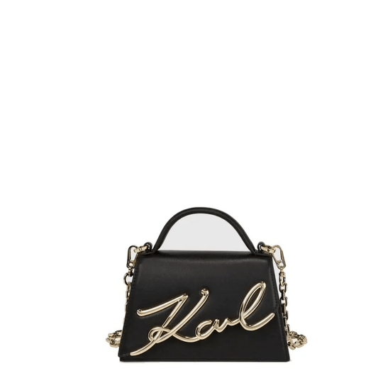 Petit sac bandoulière Karl Lagerfeld K/Signature en cuir noir, vue de face avec grand logo Karl doré en relief et poignée supérieure