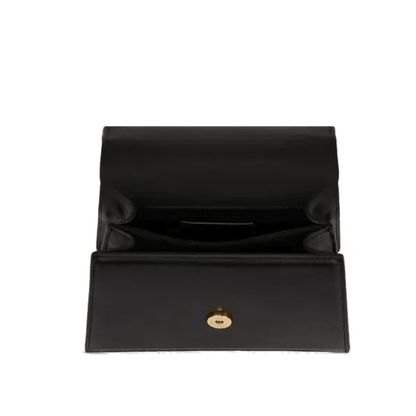 Vue intérieure du petit sac Karl Lagerfeld K/Signature noir ouvert, montrant son rabat, sa doublure sombre et ses espaces de rangement