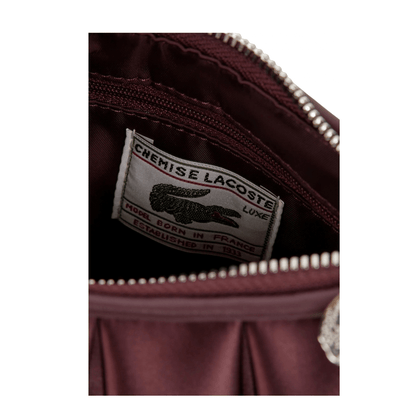 Intérieur du sac Lacoste Lenglen S Oxalis avec étiquette Lacoste et fermeture zippée