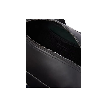 Sac de voyage Lacoste NU4658MR noir duffle bag homme bandoulière embossé 42 cm