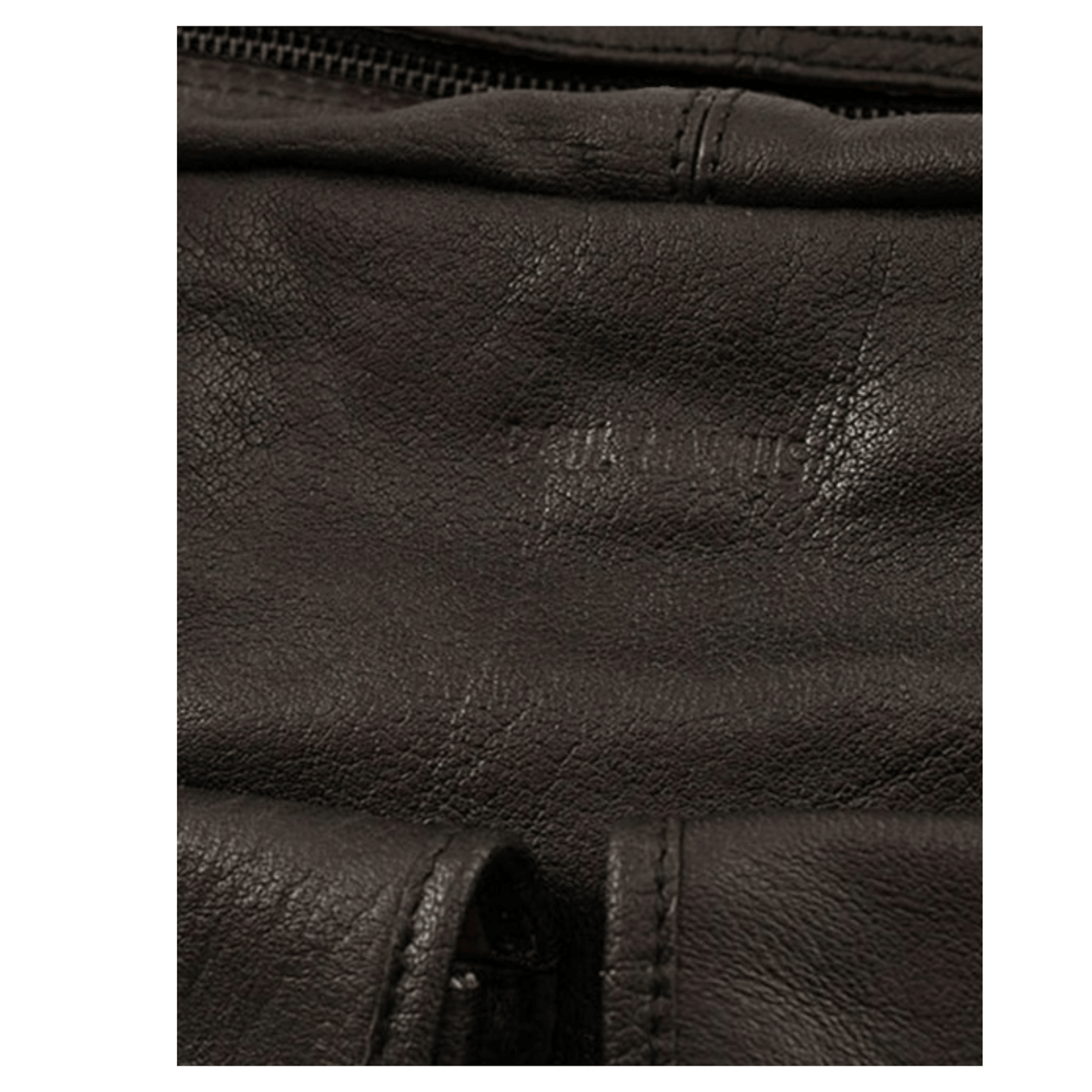 Gros plan sur le cuir de buffle pleine fleur du sac Paul Marius LeDandy noir mettant en valeur son grain naturel.