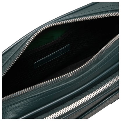 Intérieur du sac reporter Lacoste NH4561GYB43 vert sapin avec doublure sombre, poche en filet et fermeture éclair