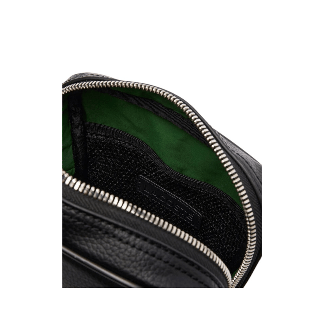 Intérieur du sac reporter Lacoste NH4783GY00 noir avec doublure verte, poche en filet et fermeture éclair argentée