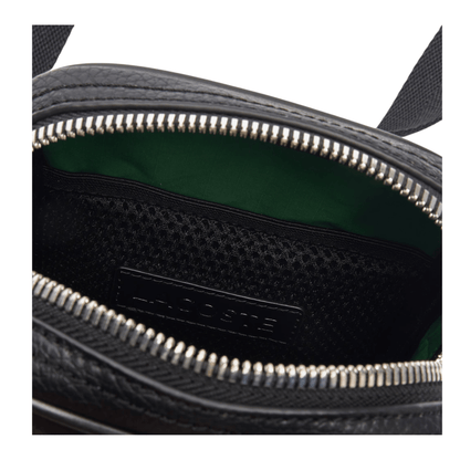 Détail intérieur de la sacoche Lacoste NH4563GY000 avec doublure verte, poche en filet et fermeture éclair métallique